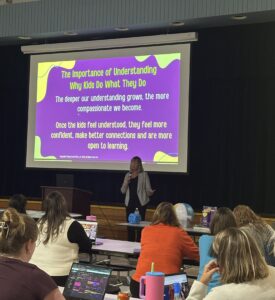 Nadine speaking to a crowd of educators